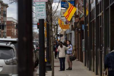 South Vietnamese flags fly on Dorchester Avenue ahead of the 40th anniversary of the fall of Saigon in 2015. (Jesse Costa/WBUR)