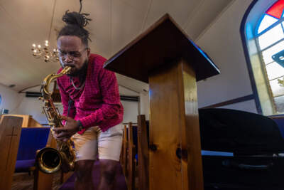 Saxophonist Seventh Sun rehearsing at Pleasant Hill Missionary Baptist Church in Dorchester. (Jesse Costa/WBUR)