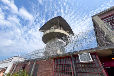 The central guard tower at MCI-Concord looks over the now-shuttered state prison. (Laney Ruckstuhl/WBUR)