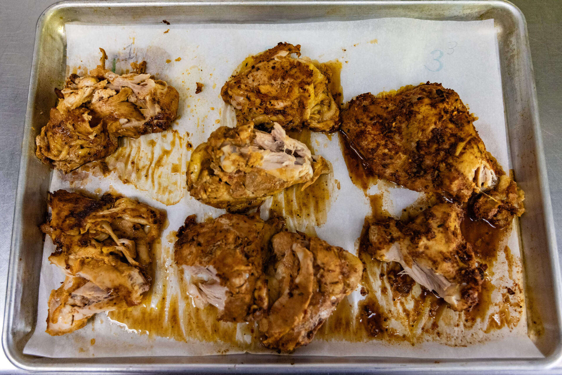 Chicken thighs seasoned with the three different taco seasonings for the blind taste test. (Jesse Costa/WBUR)