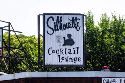 The Silhouette Lounge sign missing the man on the left side. (Jesse Costa/WBUR)