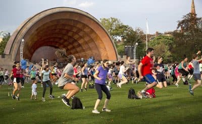 A Tuesday evening free Zumba class at Boston's Hatch Memorial Shell. (Robin Lubbock/WBUR)