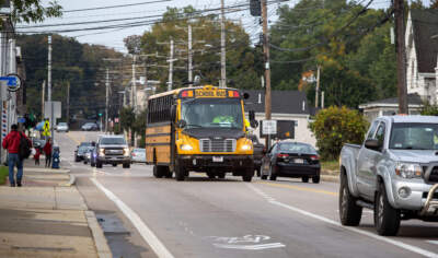 A public school bus makes its way down the street. (Robin Lubbock/WBUR)