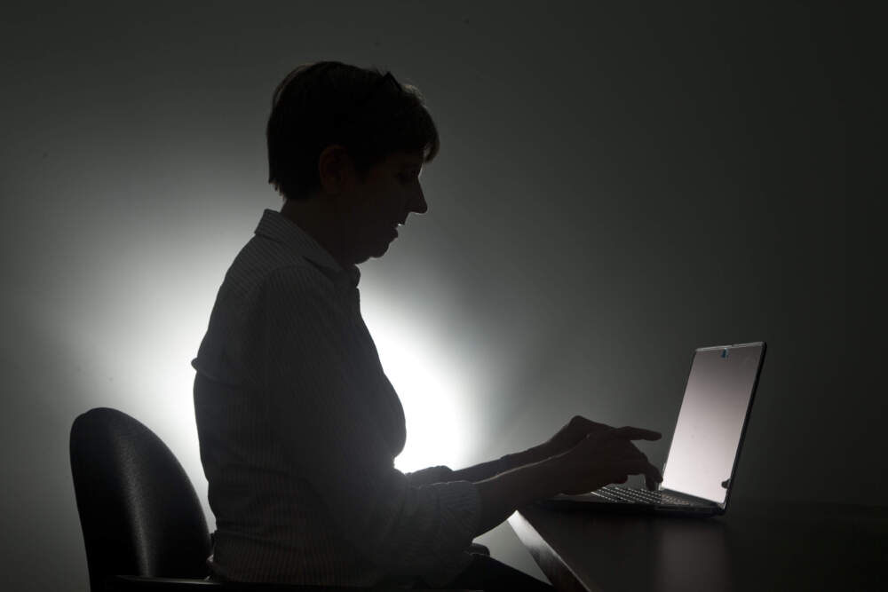 A woman on her laptop in Miami. (Wilfredo Lee/AP)