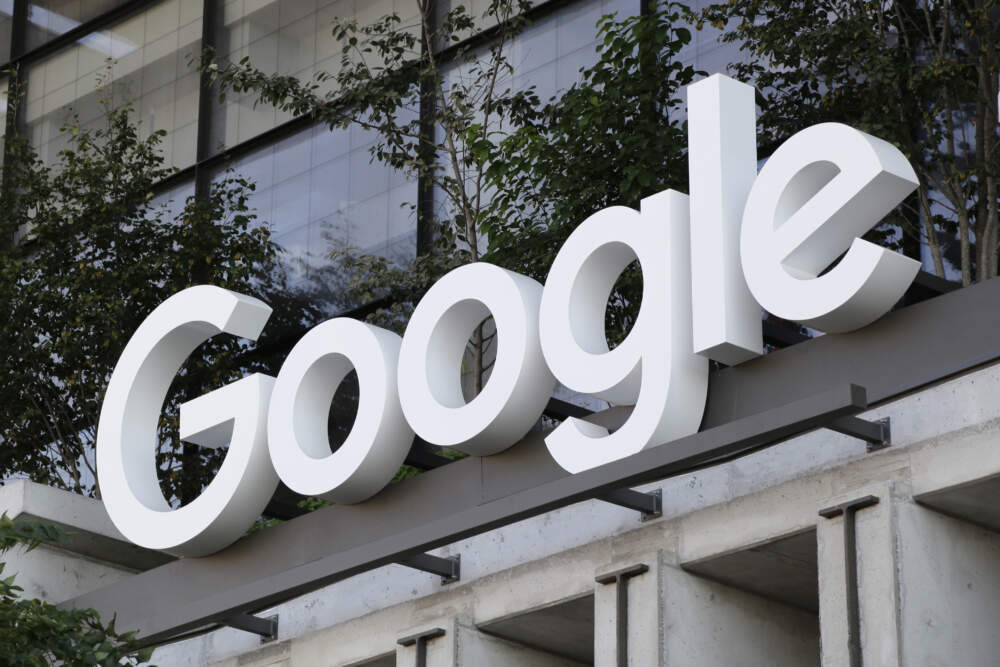 The Google sign is shown over an entrance to the company's new building in New York.  (Peter Morgan/AP)