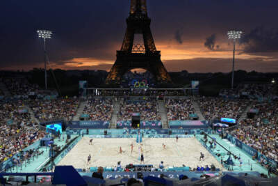 Canada's Melissa Humana-Paredes and Brandie Wilkerson, on left, face Switzerland's Zoe Verge-Depre and Esmee Boebner in a beach volleyball match at Eiffel Tower Stadium at the 2024 Summer Olympics, Wednesday, July 31, 2024, in Paris, France. (AP Photo/Robert F. Bukaty)