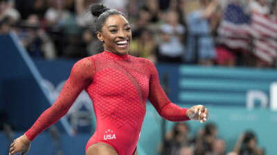 Simone Biles, of the United States, smiles after competing during the women's artistic gymnastics individual vault finals at Bercy Arena at the 2024 Summer Olympics, Saturday, Aug. 3, 2024, in Paris, France. (Charlie Riedel/AP)