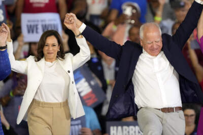 Democratic presidential nominee Vice President Kamala Harris and running mate Minnesota Gov. Tim Walz at a campaign rally on Aug. 7, in Romulus, Michigan. (Carlos Osorio/AP)