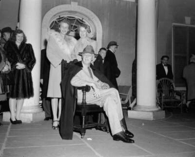 President Franklin Roosevelt, his daughter, Mrs. John Boettiger, left, and his wife, Mrs. Eleanor Roosevelt are shown on the portico of their Hyde Park, N.Y. home as they greeted well wishers after news of Roosevelt's reelection to an unprecedented fourth term, November 8, 1944.  (AP Photo)