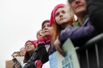 Protesters gather at the barricades for the Women's March on Washington during the first full day of Donald Trump's presidency, Saturday, Jan. 21, 2017 in Washington. (AP Photo/John Minchillo)