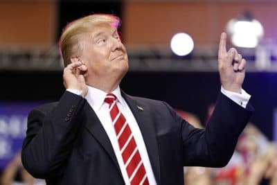 President Donald Trump reacts to the song as he arrives at a rally at the Phoenix Convention Center, Tuesday, Aug. 22, 2017, in Phoenix. (Alex Brandon/AP)