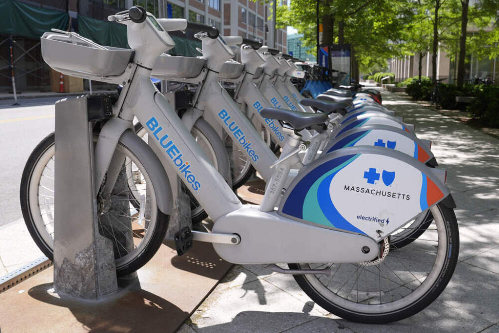 Electric Bluebikes docked near the MBTA Kendall/MIT subway station in Cambridge. (Charles Krupa/AP)