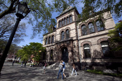 Passers-by walk past Sayles Hall on the campus of Brown University, in Providence, R.I. (Steven Senne/AP)