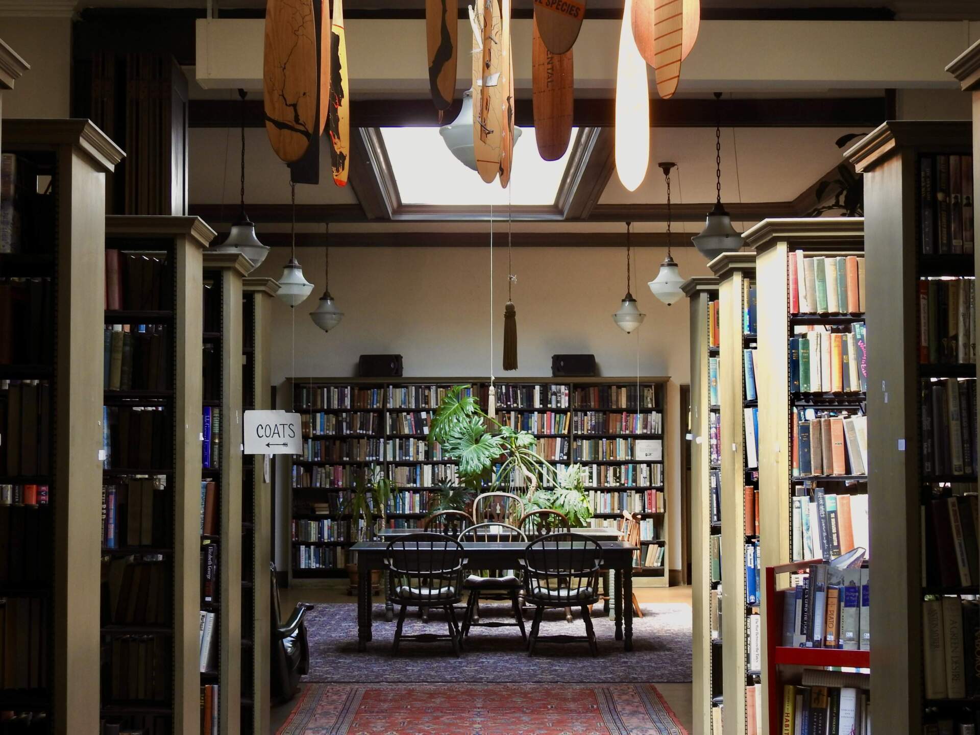 Handcrafted oars dangle from the skylight at the Institute Library in New Haven, Conn. (Eda Uzunlar/WSHU)