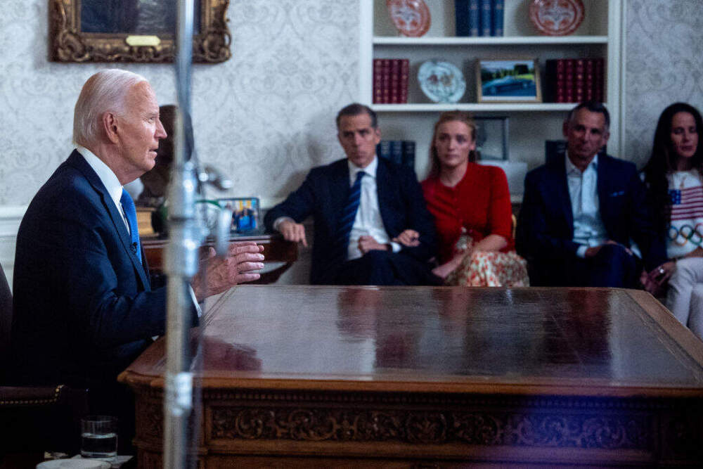 U.S. President Joe Biden, accompanied by his son, Hunter Biden, Hunter's daughter Finnegan Biden, Howard Krein, and Ashley Biden, speaks during an address to the nation about his decision not to seek reelection in the Oval Office at the White House on July 24, 2024. (Andrew Harnik/Getty Images)