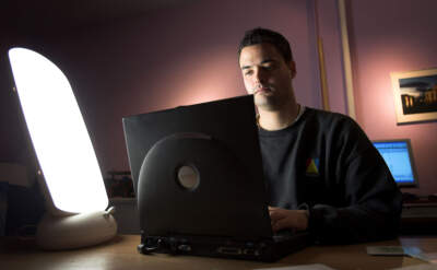 A man suffering from Seasonal Affective Disorder uses a light box in his office to combat the illness on October 12 2005 Glasgow, Scotland.(Christopher Furlong/Getty Images)