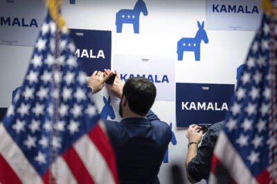 Campaign staff put up signs at Vice President Kamala Harris' campaign headquarters in Wilmington, Del., on July 22. (Erin Schaff/The New York Times via AP, pool)